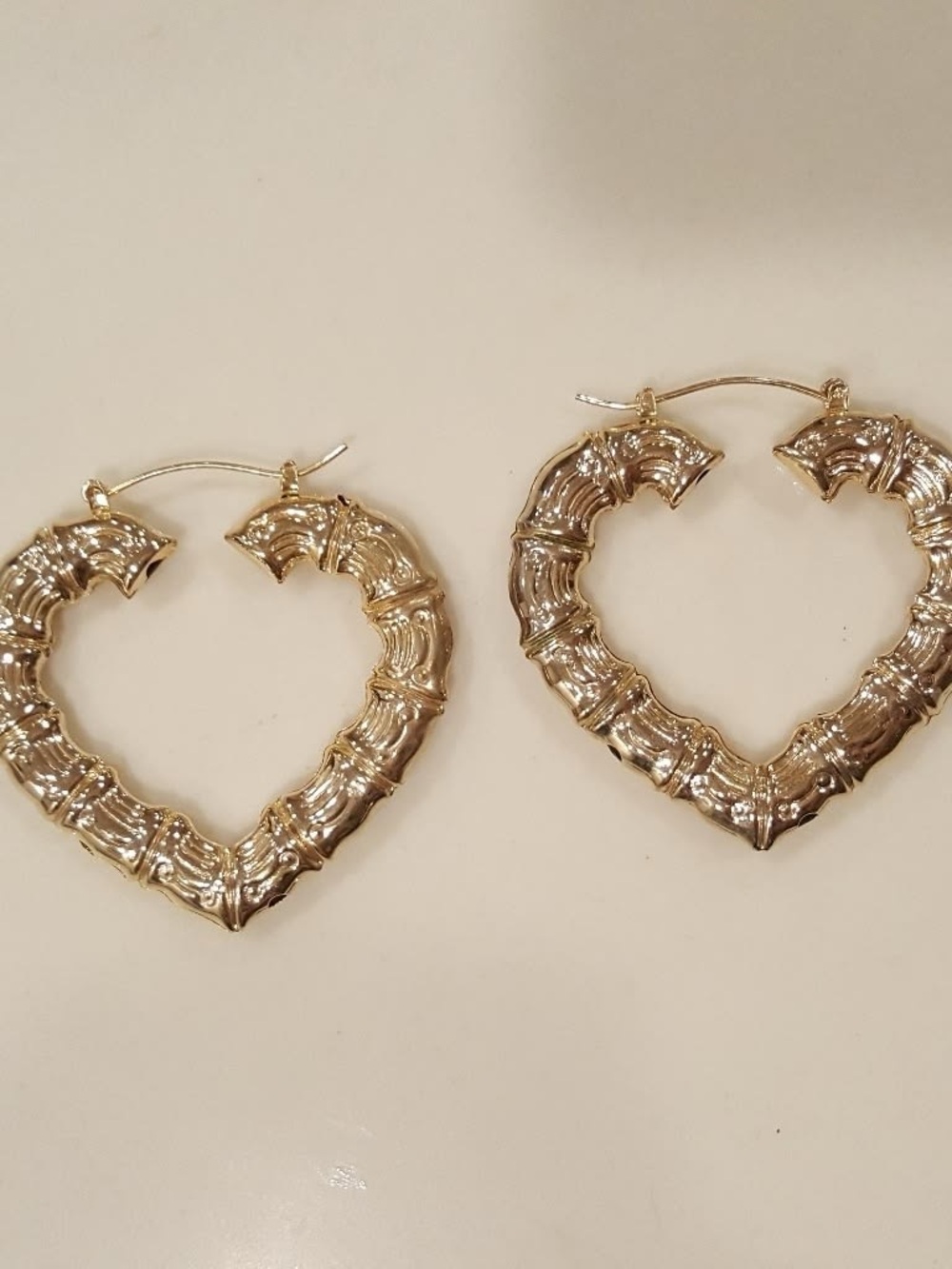Gold Heart-Shaped Bamboo Hoop Earrings comes with 3 pairs.